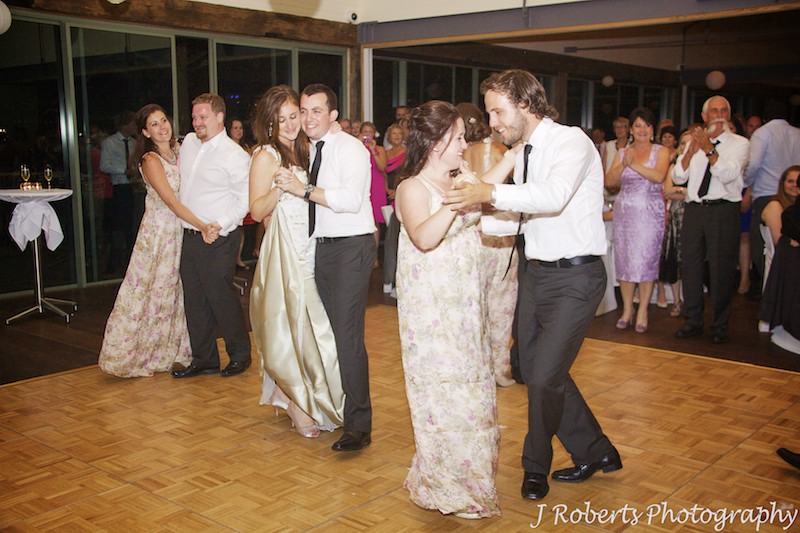 Couple and bridal party on the dance floor - wedding photography sydney